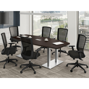 short brown table with silver legs in office surrounded by chairs